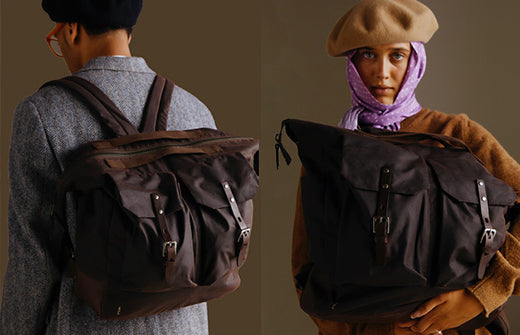 two models wearing and carrying brown Ally Capellino Backpacks