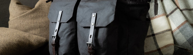Frank reclining , waxed cotton backpack in dark brown