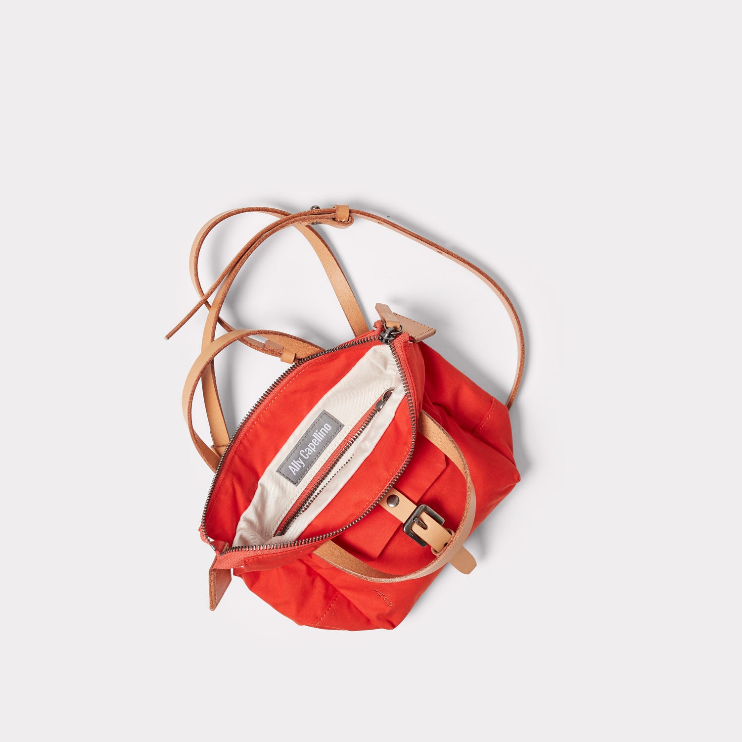 Squat 2.0 Waxed Cotton Mini Crossbody Bag in Lava