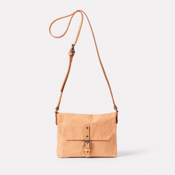 Waste You Want Friday Waxed Cotton Crossbody Bag in Peach