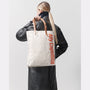 Clementine Medium Canvas Tote in Natural on model