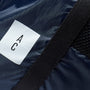 Harvey Packable Drawstring Tote/Backpack in Navy and Grey logo detail