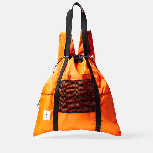 Harvey Packable Drawstring Tote/Backpack in Orange front