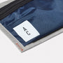 Herbert Packable Zip Top Belt Bag in Navy and Grey logo detail
