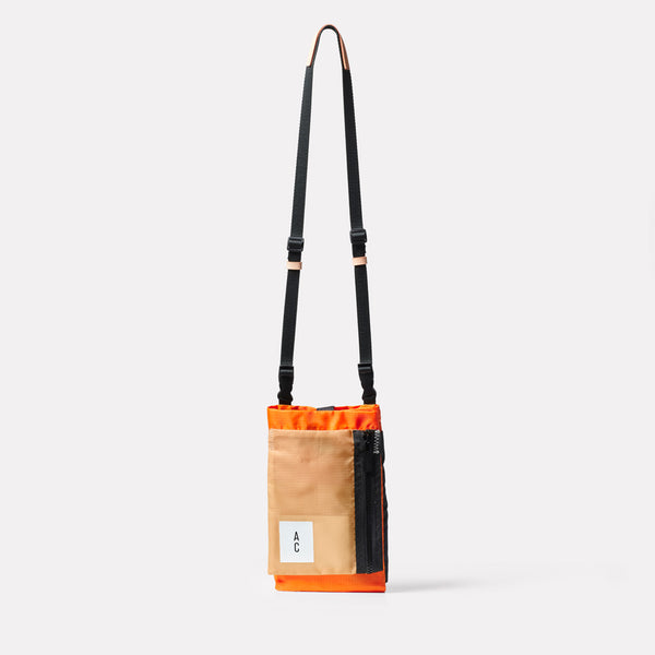 Herve Packable Pouch in Orange folded front