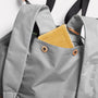 Harvey Packable Drawstring Tote Backpack in Brown side pockets