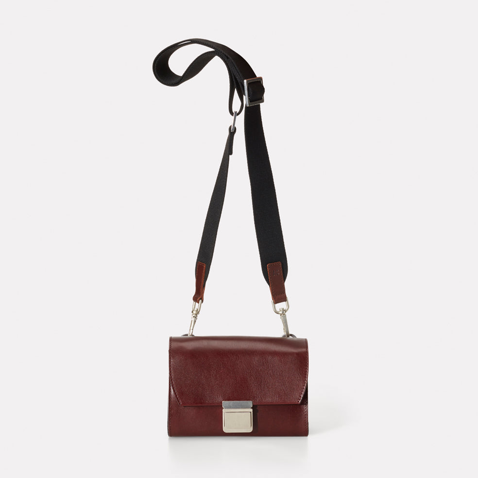 Boxy push shop lock crossbody bag