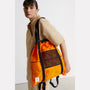 Harvey Packable Drawstring Tote Backpack in Orange model image