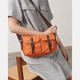 Franco Waxed Cotton Crossbody Bag in Terracotta campaign image
